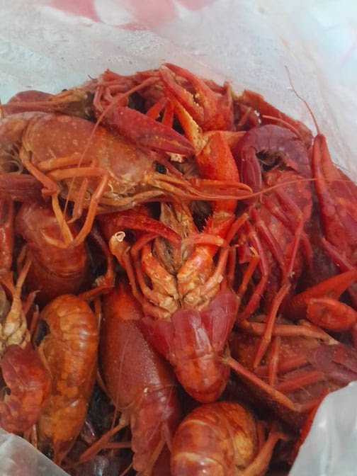 Boiled shrimp served in a simple tray.